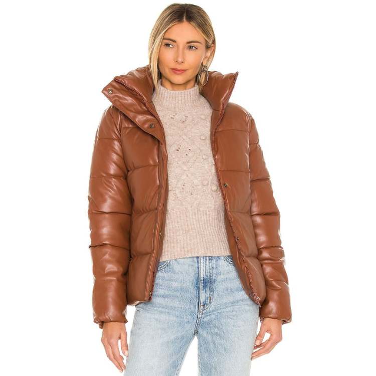 Woman in Brown Puffer Winter Coat Aspen Outfit Idea