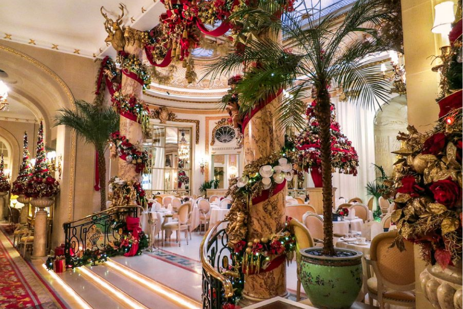 Elegant Christmas decorations and a grand tree inside The Ritz London, one of the most iconic London Christmas Hotels.