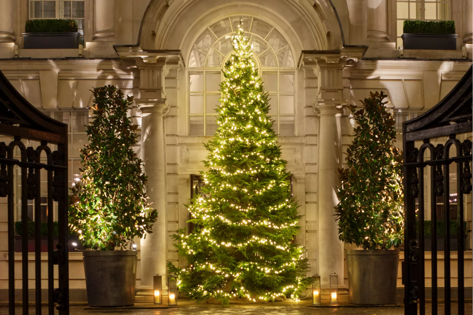 Snow-kissed courtyard and glowing Christmas tree at The Rosewood London, one of the best hotels for London Christmas stays.
