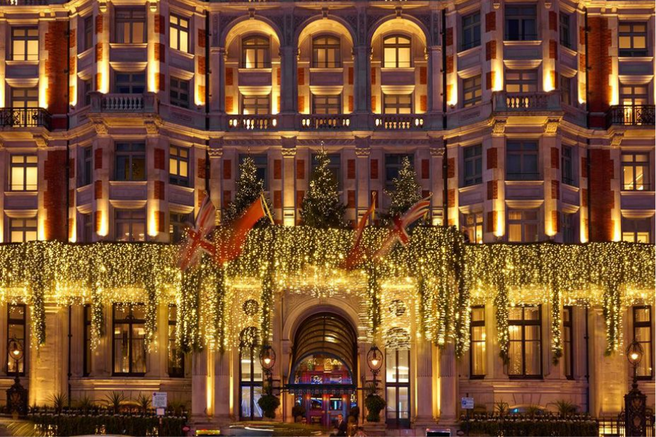 Mandarin Oriental Hyde Park overlooking the Royal Parks, twinkling with festive lights, a favorite among London Christmas Hotels.