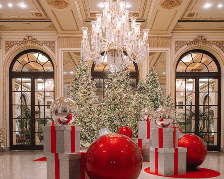 The Plaza Hotel elegantly decorated for the holidays, one of the most iconic New York City Christmas Hotels near Central Park.