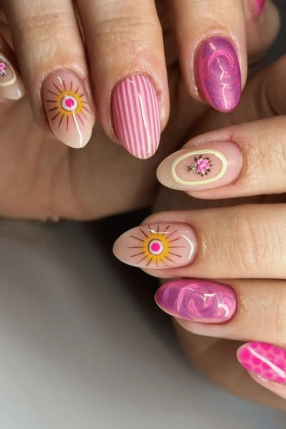 woman's hands with colorful boho nail designs